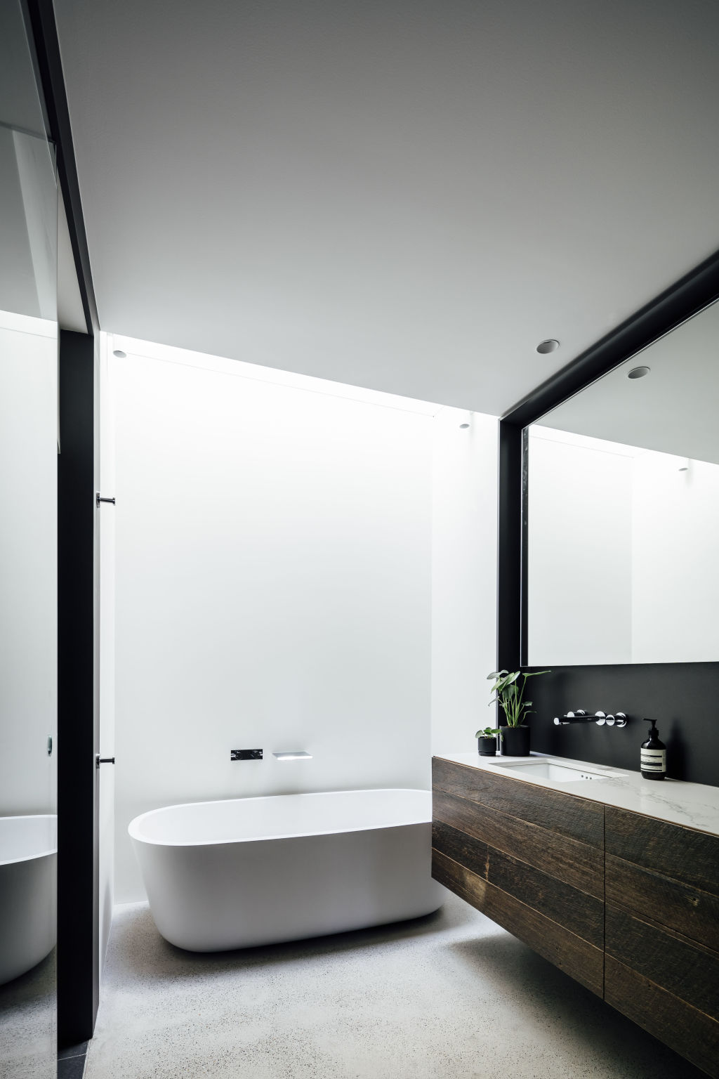 The central skylight above a very small main bathroom makes it breathe and makes it bright. Photo: Michael Kai