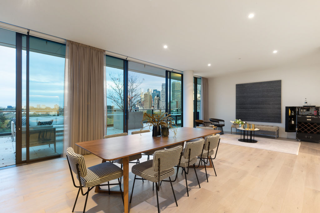 The dining space at 911/280 Albert Street, East Melbourne with amazing city views. Photo: RT Edgar