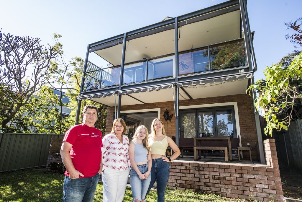 Dana Reed and her husband Rodney with their daughters Nicole and Ashley who have moved out. Photo: Steven Siewert