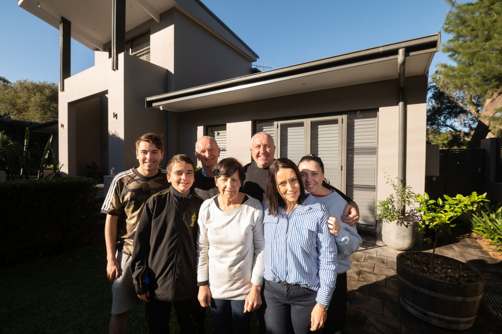 Rebecca Bissett with her family at her parents' home. Photo: Steven Saphore