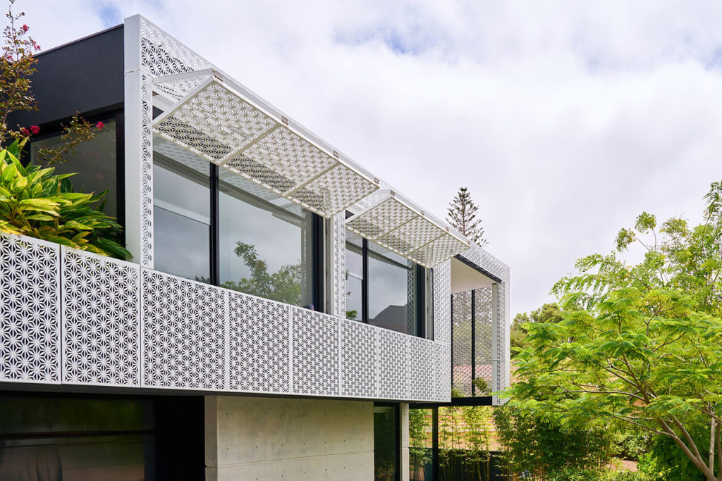 Mobile panels offer optional privacy in a decorative metal screen. Photo: Stefan Gosatti