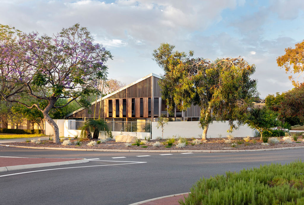 In a busy Perth suburban context this house sought buffering behind a beautiful screen. Photo: Bo Wong