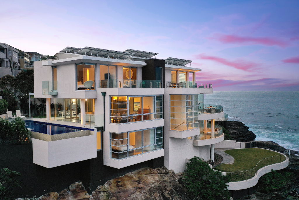 The waterfront house has four storeys, with five bedrooms and four bathrooms.
