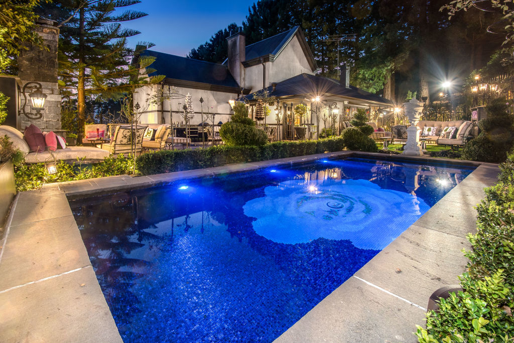 The swimming pool features a show-stopping rose-printed floor.