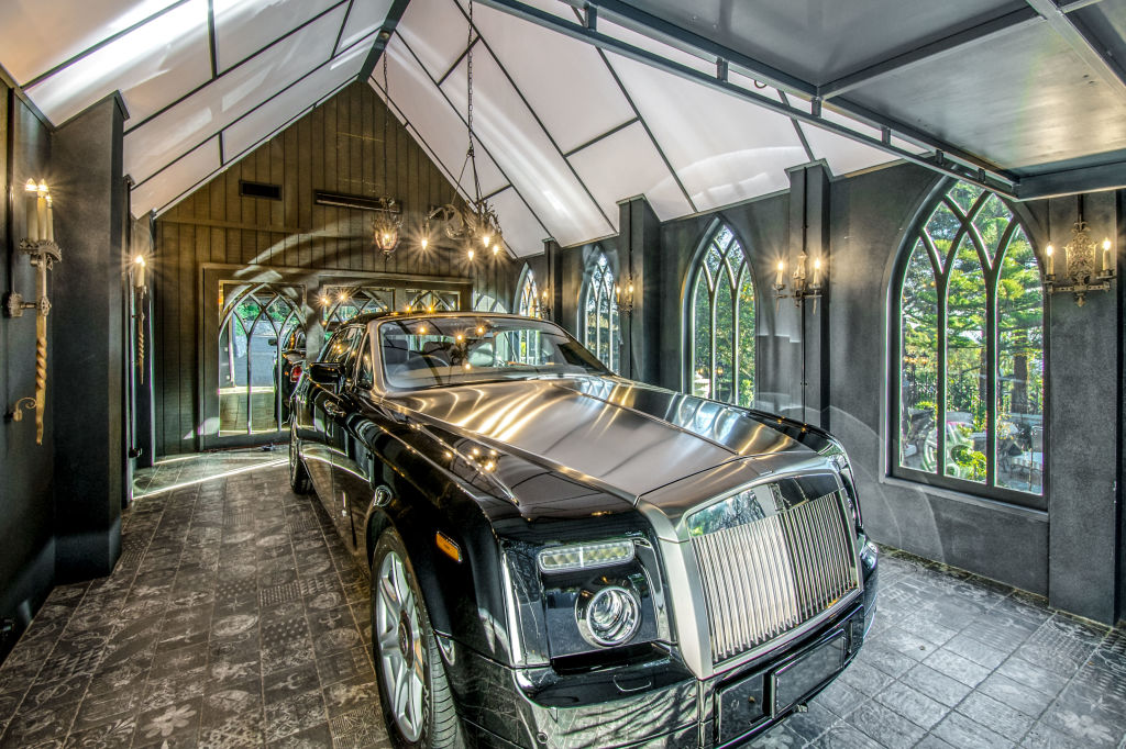 A luxury car is parked in the newly built garage.