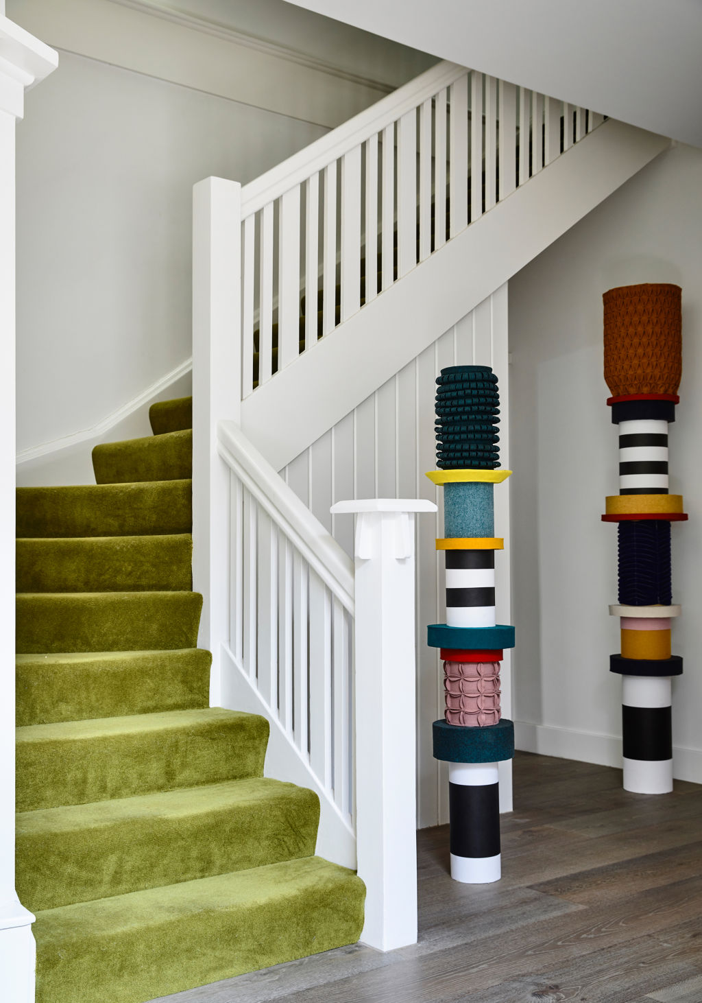 Doherty encourages the introduction of colour in unexpected ways, as seen in this pop of green carpet on the staircase. Photo: Derek Swalwell