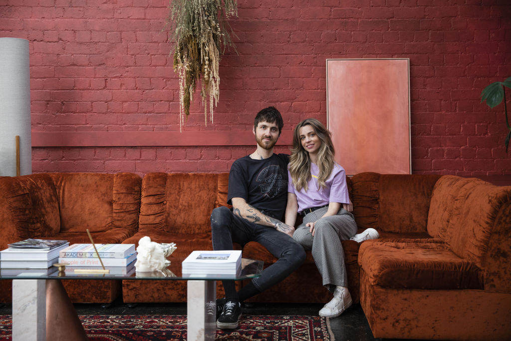 The red room: A red velvet modular couch brings a retro feel to the lounge area. Photo: Charlie Kinross