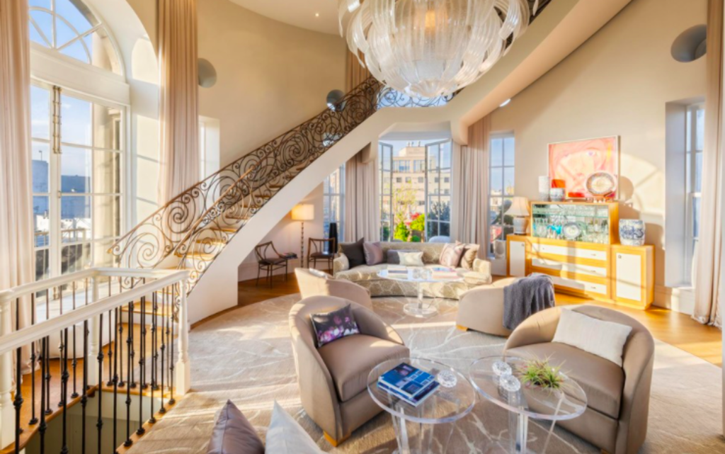 With a grand staircase. Photo: Douglas Elliman