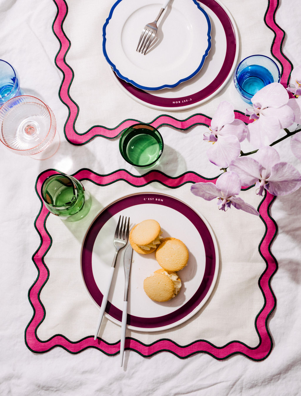 Think outside the box to ensure your dinner party is a hit. Dinner table setting with linen and plates from In The Roundhouse. Photo: In The Roundhouse.