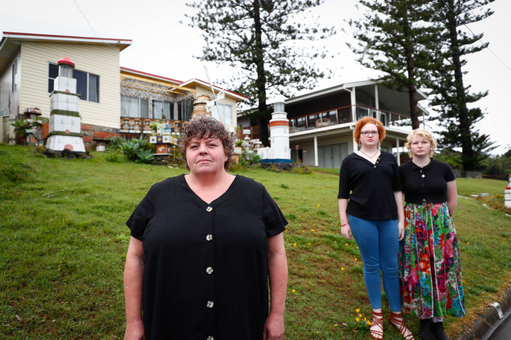 Belinda Nelson and her daughters Lilly, 14 and Indigo, 15, pictured out front of their former rental which is due to be demolished, have had to bid farewell to Ballina. Photo: Danielle Smith