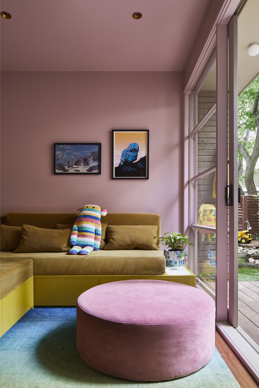 The former garage is now a colourful second living space. Photo: Armelle Habib