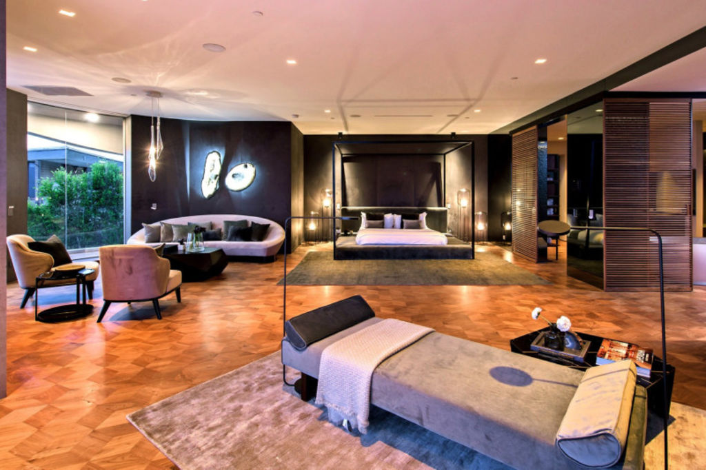 One of the seven bedrooms in the extravagant mansion. Photo: Dirt/Unlimited Style Photography