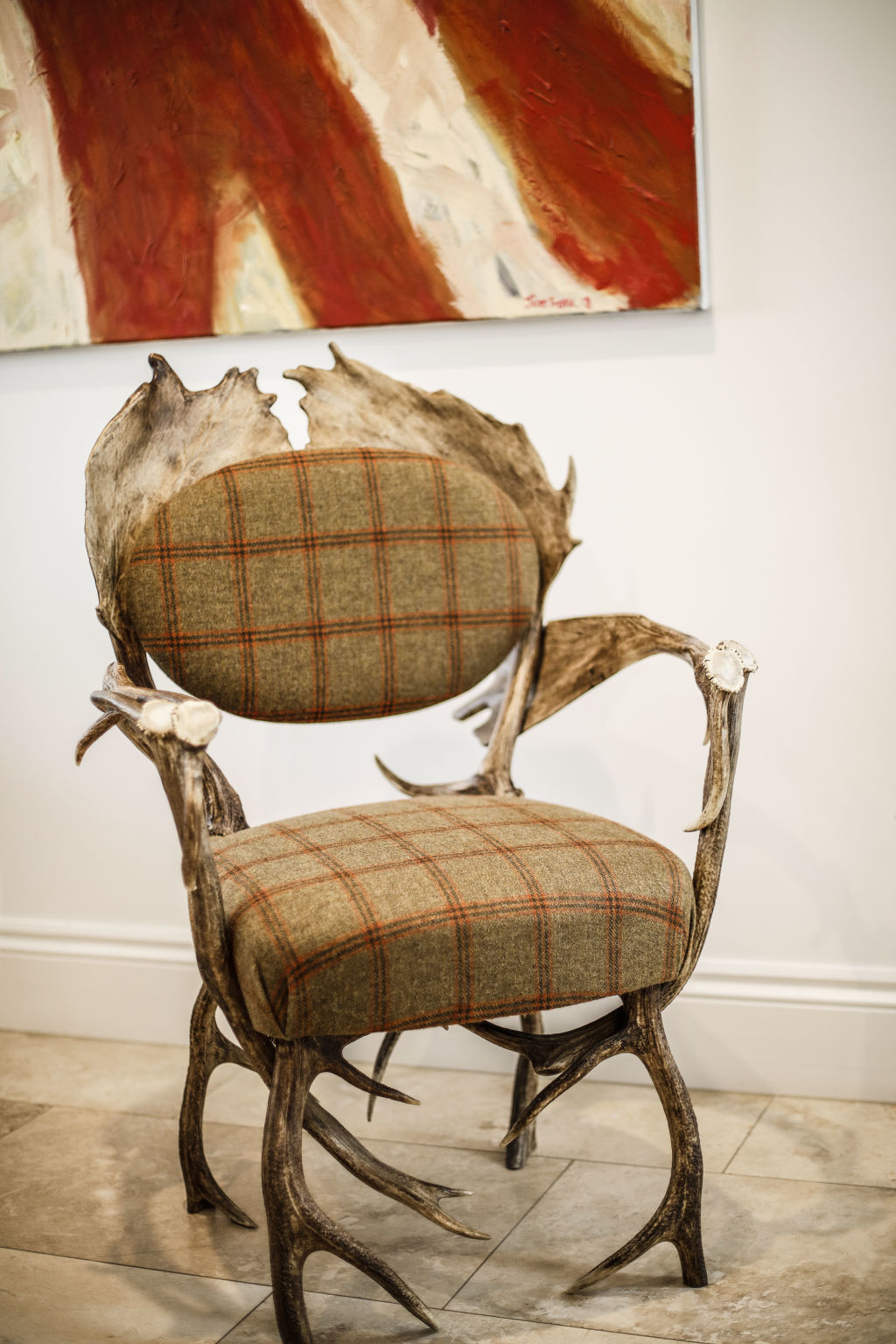 A Scottish antler chair made from red deer antler and woven tapestry sits proudly in the home. Photo: Julian Kingma