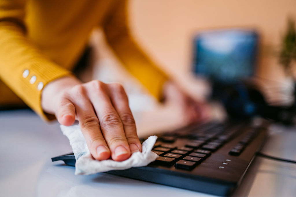 Use an alcohol wipe to disinfect your computer, keyboard and mouse. Photo: iStock