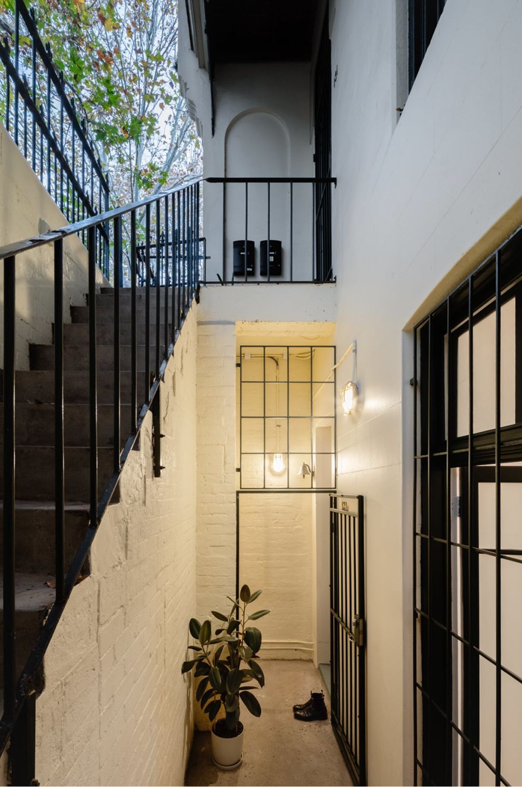 The entry to the apartment is below ground level. Photo: Katherine Lu