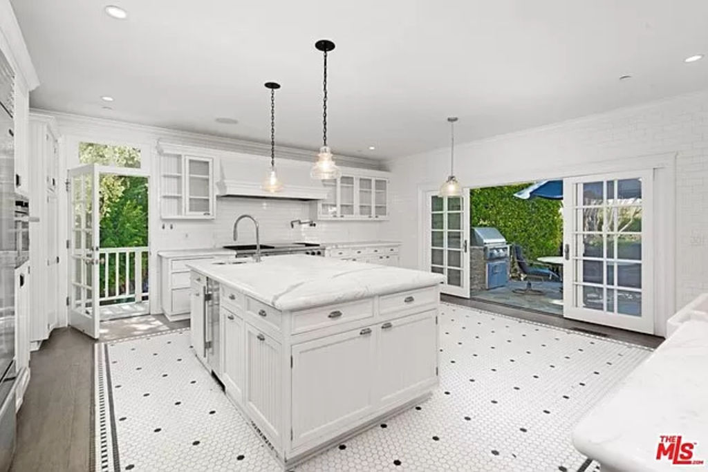 The large kitchen opens out to an al fresco entertaining area. Photo: Zillow