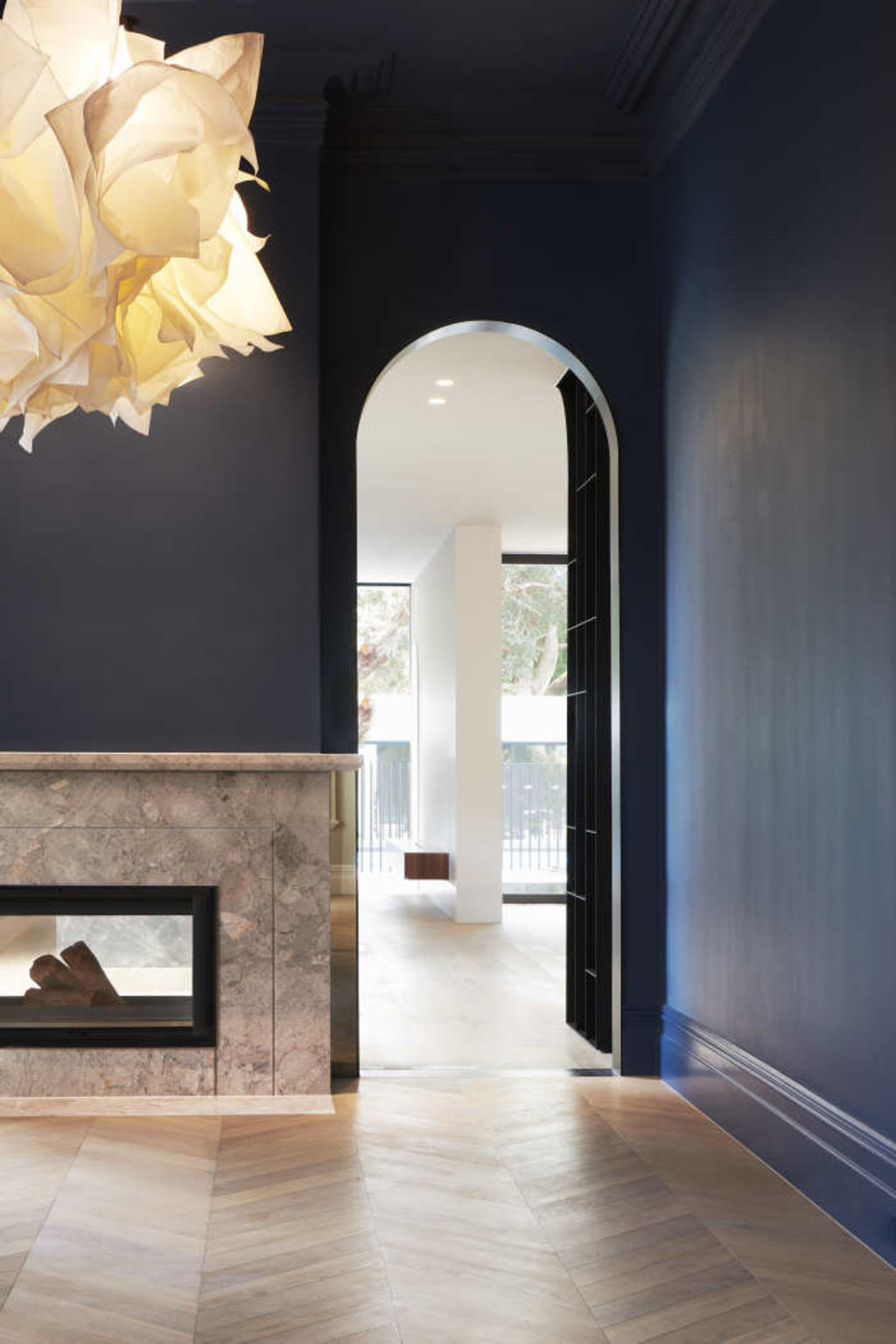 Dark blue in the dining room sets off the cloud lighting feature. Photo: Dominik Scmarsel