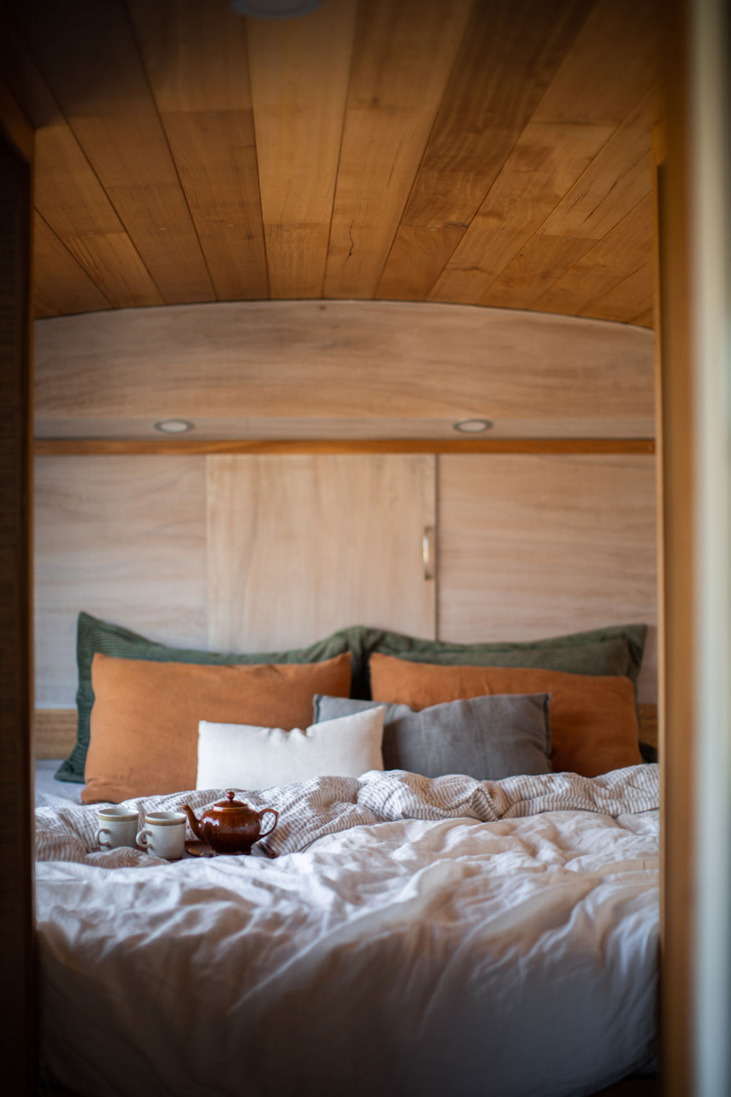 The bus is now offered as guest accommodation and features linen sheets, hand-made ceramics and artwork by local artisans.  Photo: Lauren McKinnon