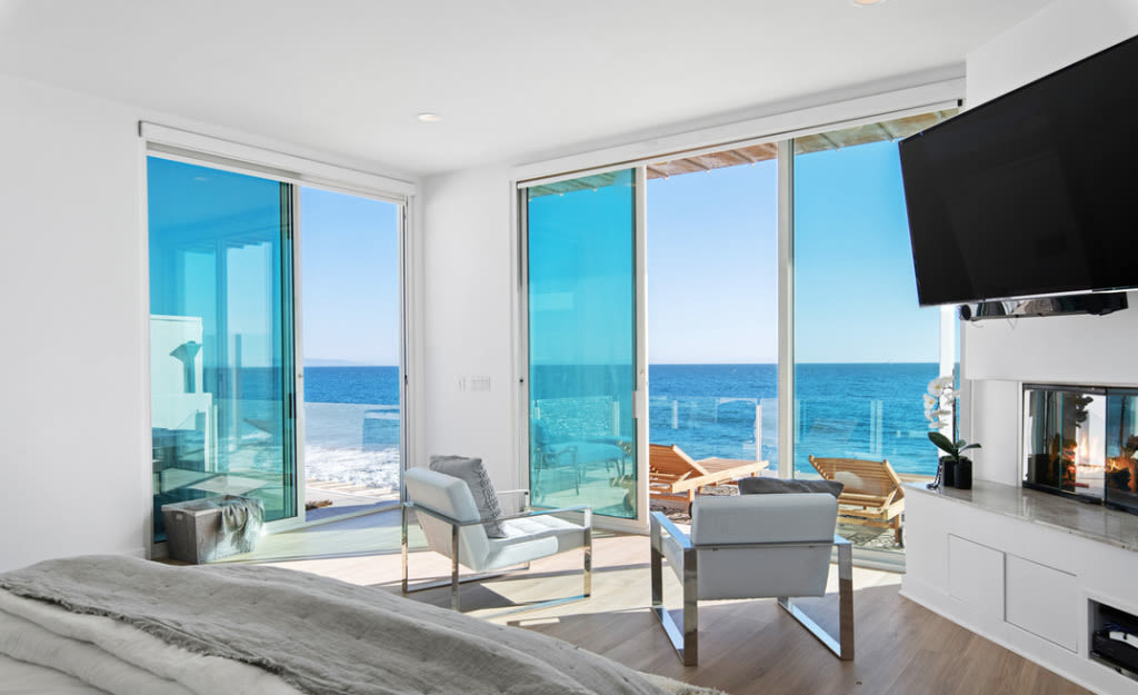 The main bedroom with private balcony. Photo: Redfin.
