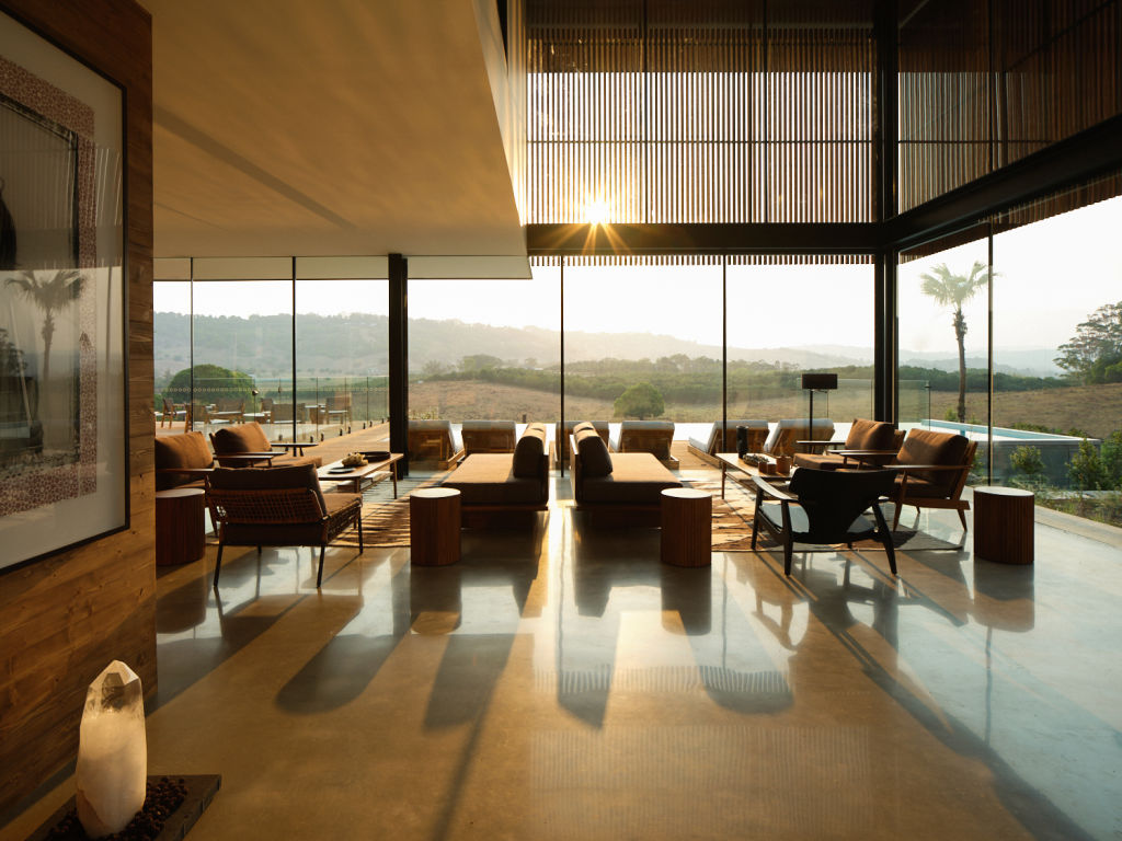 The sun-drenched lounge room overlooking the pool area.  Photo: Romello PEREIRA