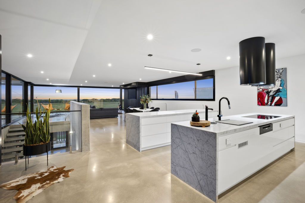 The designer kitchen and living space.  Photo: McCartney Real Estate