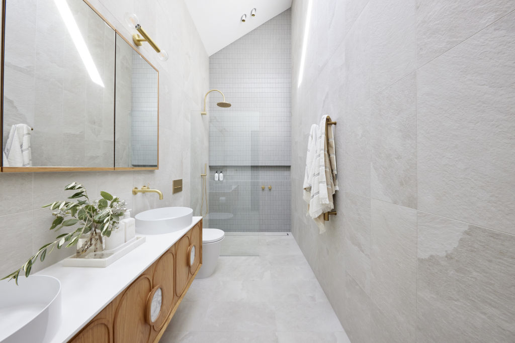 Laying tiles floor-to-ceiling draws the eye upwards, creating a feeling of openness. Photo: Channel Nine