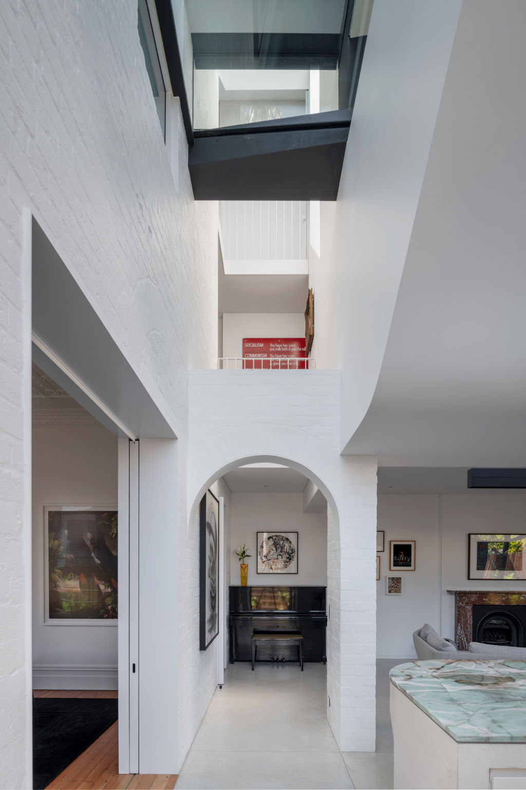 The architect says this three-level open atrium insists on visitors pausing to look up. Photo: Willem Rethmeier