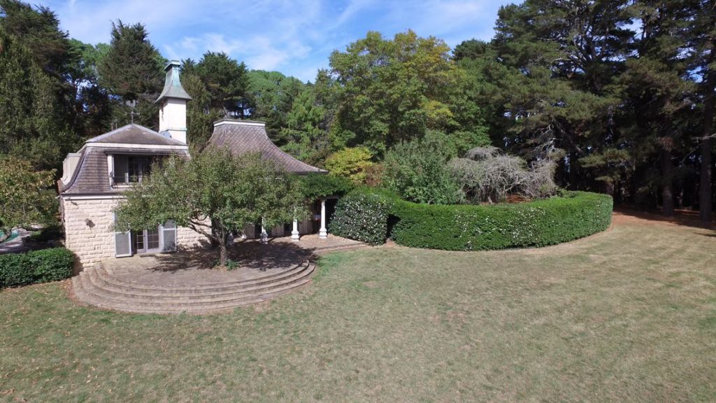 The French provincial-style residence was designed by architect John Amory with a distinctive mansard roof.