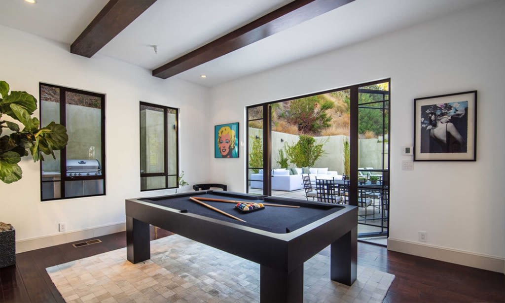 There is classic artwork throughout the home.  Photo: Redfin.