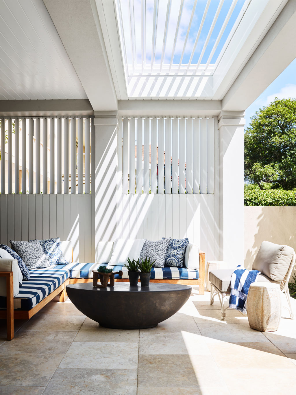 The garden has evolved into the outdoor room, with sophisticated furnishings. Photo: Anson Smart.