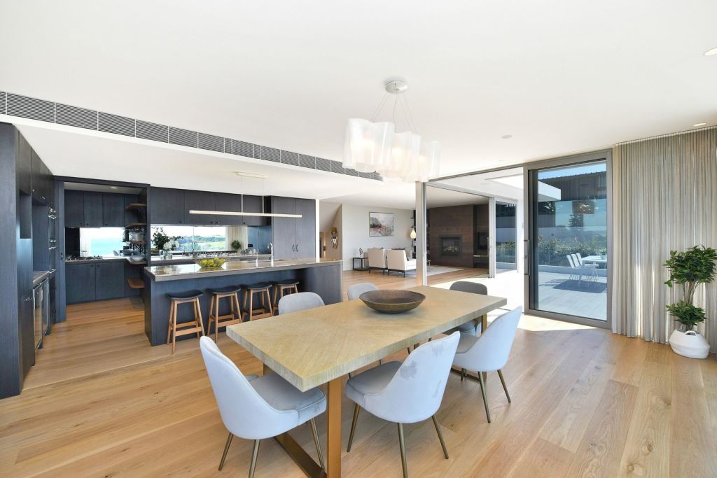 An open plan living, dining and kitchen area takes up most of the ground floor.