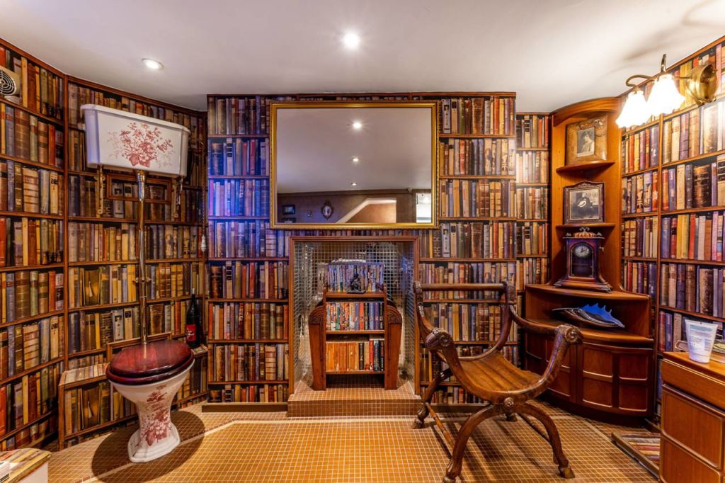 This is a bathroom and none of the books on the wall is readable on the toilet. Photo: Foxtons