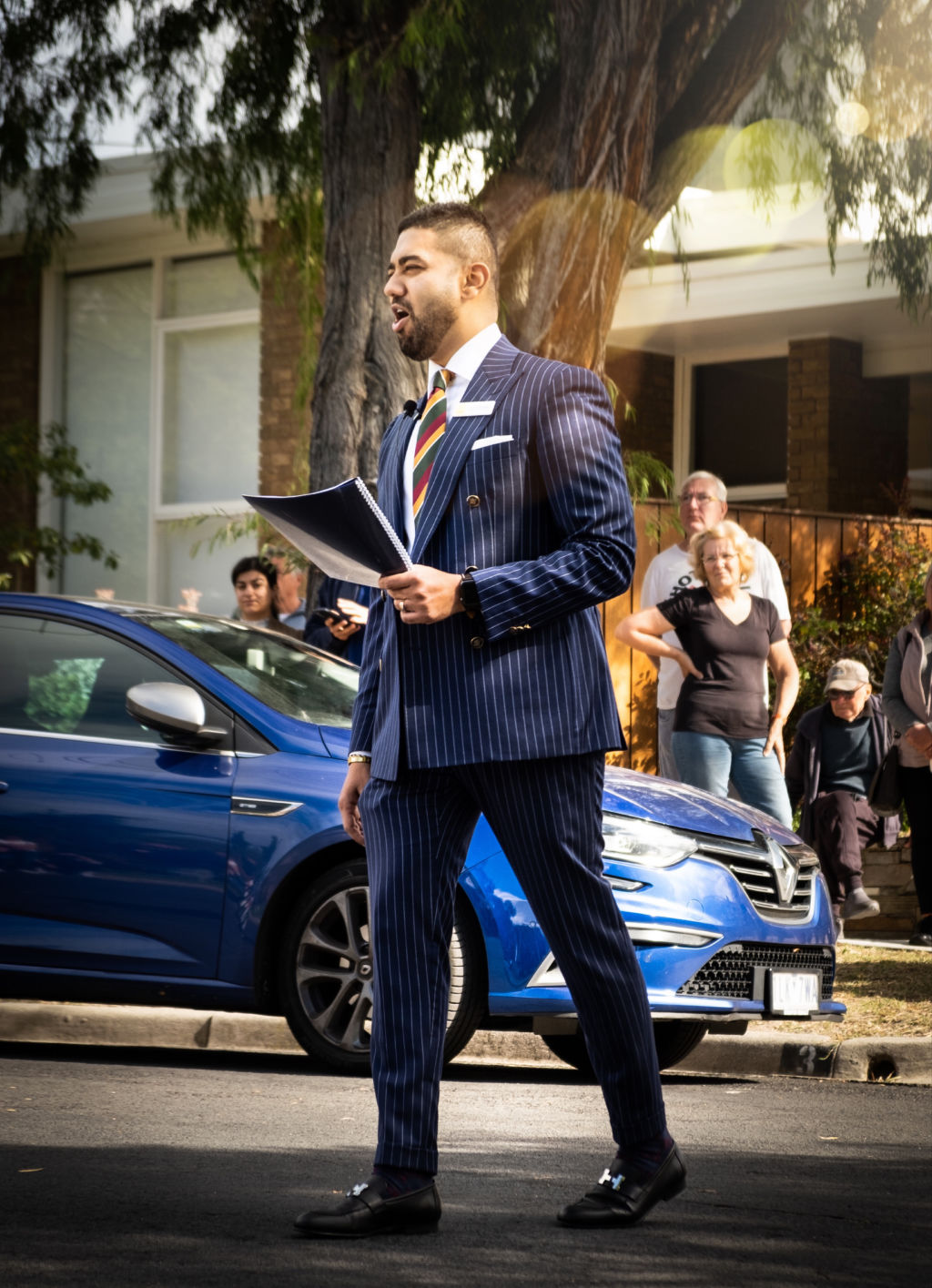 Ray White Cheltenham agent Kevin Chokshi in action on auction day. Photo: Supplied