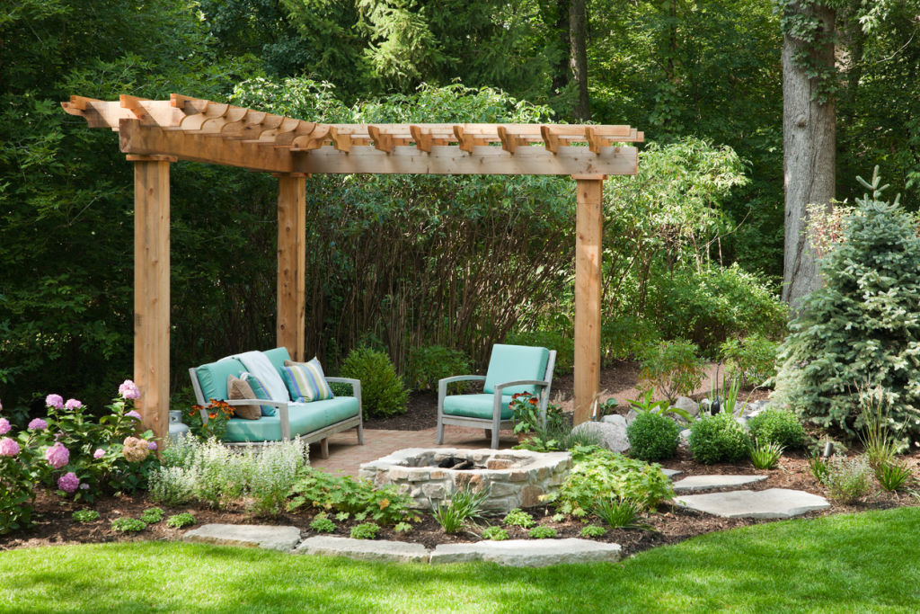 A fire pit will set the mood and 'zoning' furniture will make it easier for guests to mingle. Photo: iStock