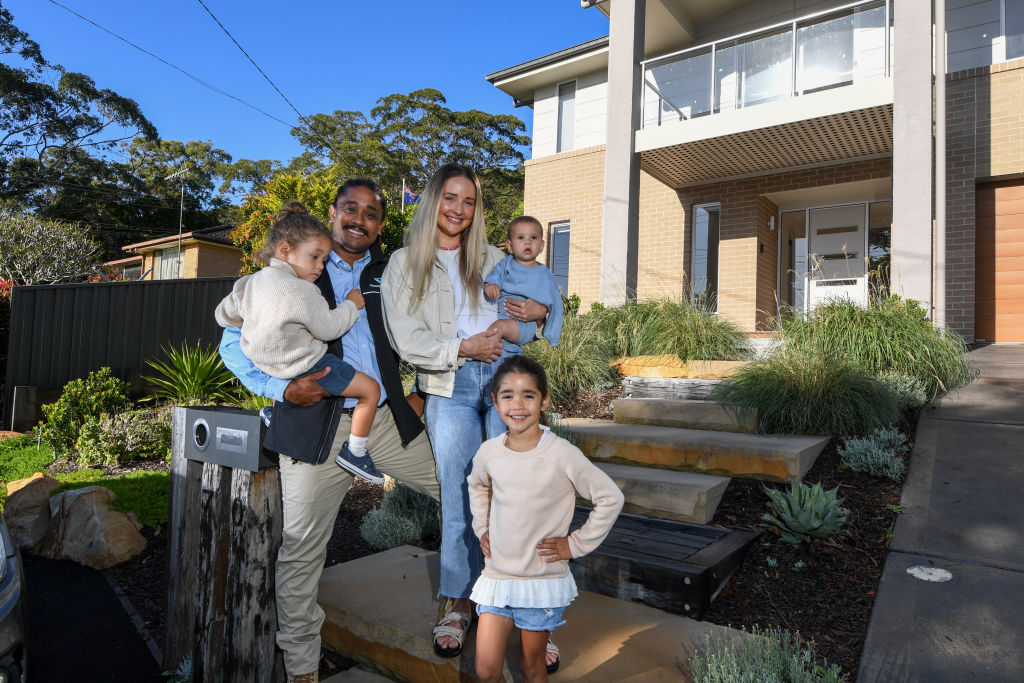 Dean Houghton and Stephanie Luck who with their three children, oldest Zyla, Huxley and baby Lennox, decided to move to Empire Bay, Central Coast. The family made the move to the suburb as the latest lockdown hit a few months ago for a better lifestyle.  Photo: Peter Rae