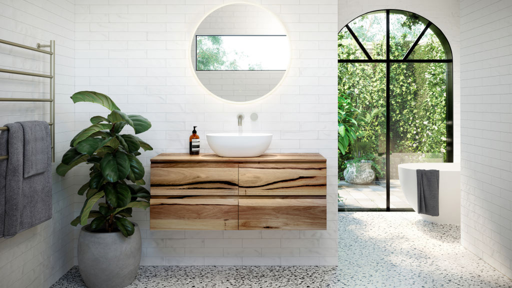 Add some mood lighting with backlit mirrors and medicine cabinets. Photo: Reece
