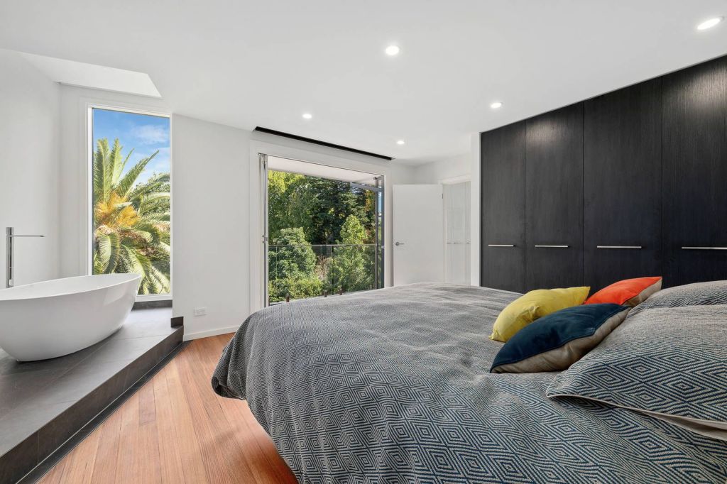 The unique home had a bath next to the window, Balinese style, in the main bedroom. Photo: Marshall White Stonnington