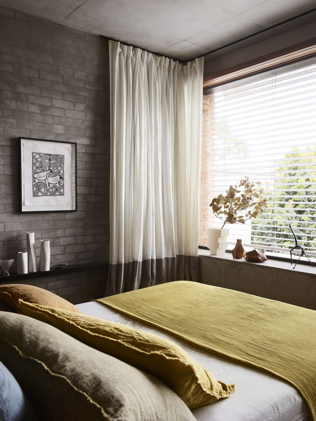 The main bedroom enjoys a leafy green outlook from its window. Photo: Supplied