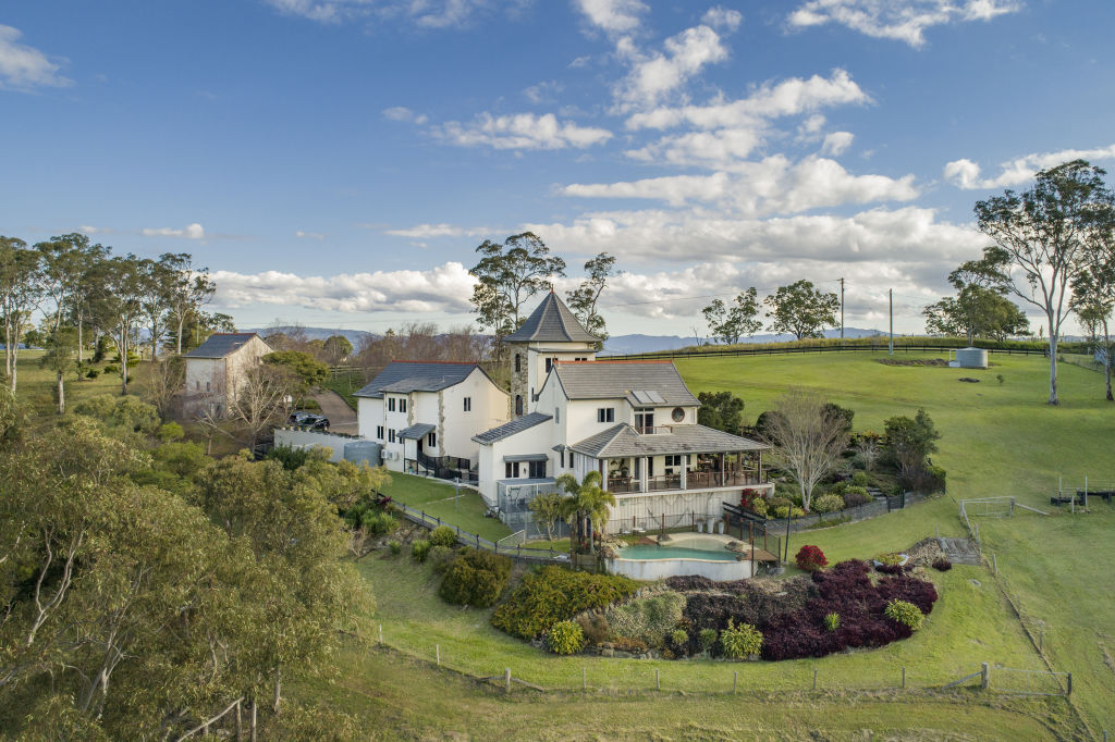 This French-style estate on a four-hectare parcel overlooks the Glass House Mountains and the Sunshine Coast. Photo: Supplied