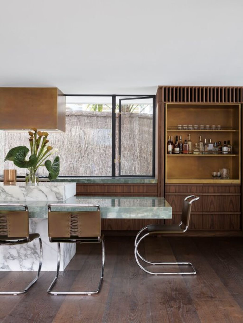 The kitchen has a combination of green and white marble. Photo: Anson Smart