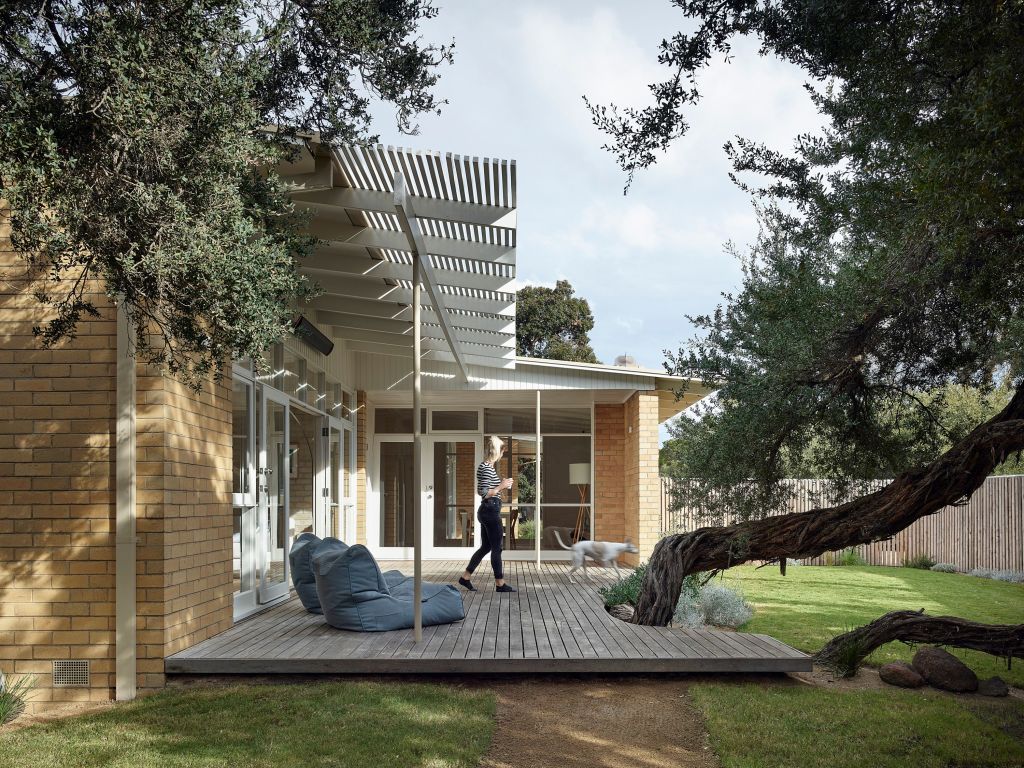 A 1950s Beaumaris house was reinvigorated and released from a choking garden. Photo: Derek Swalwell
