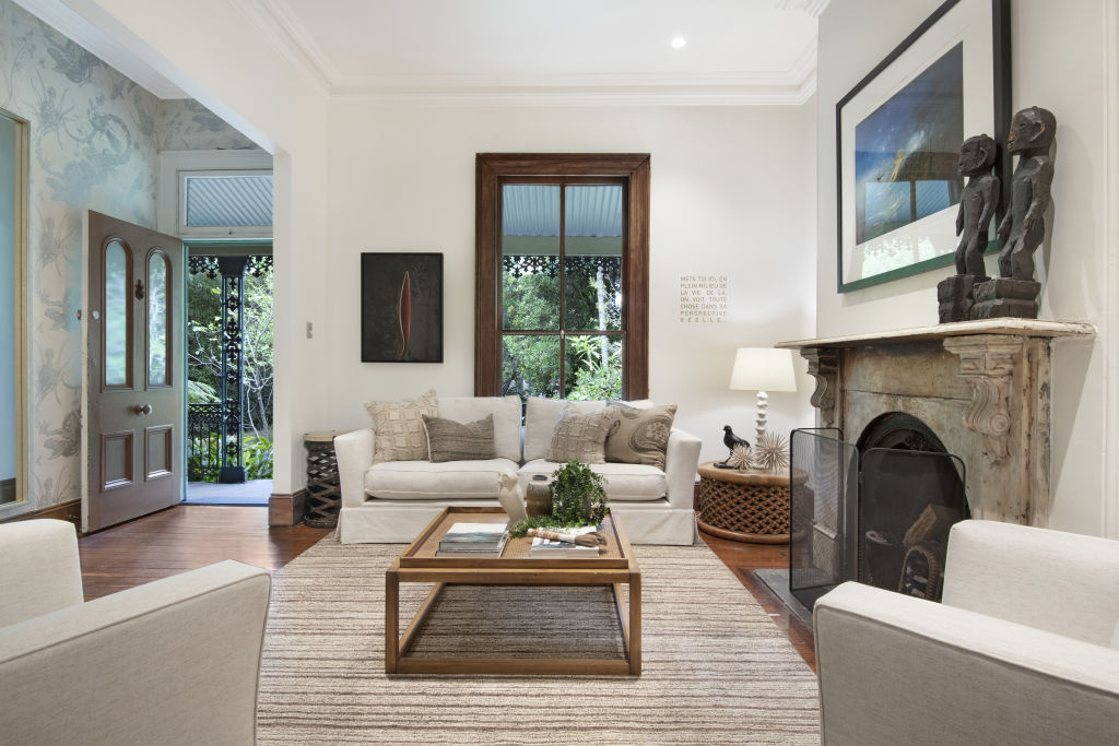 The formal living room has period features such as high ceilings, a fireplace and original floorboards. Photo: Supplied