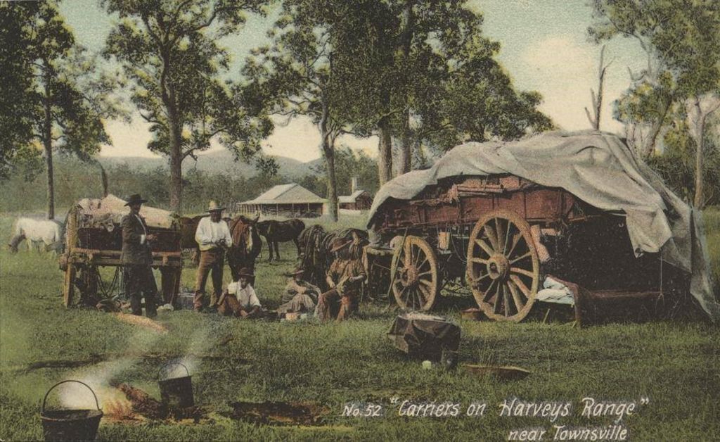 The building in the backdrop of this photo of teamsters taking a break in their day.