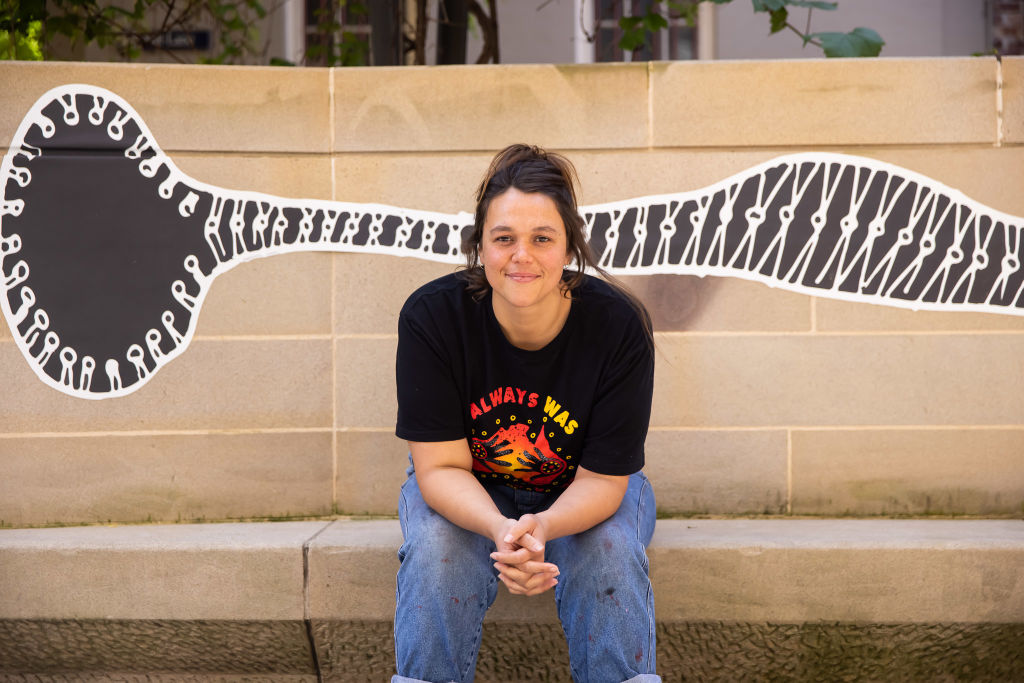Maddison Gibbs with her piece 'Spirits Make Noise'.