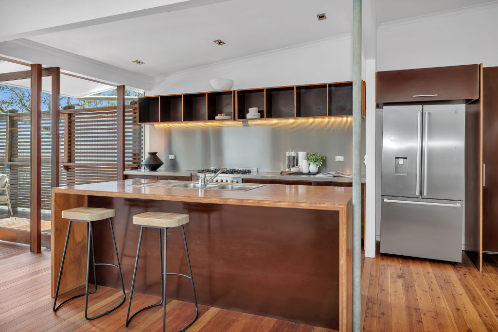 The all-timber kitchen exudes warmth and homeliness.  Photo: Donna Johnston
