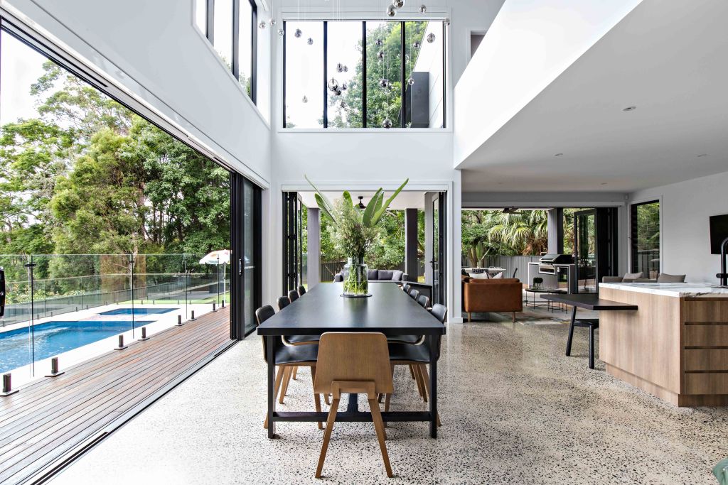 Unlike the closed-off, windowless dining rooms of old, modern dining rooms are being integrated into airy, open spaces. Interiors by Birdblack Design. Photo: The Palm Co.