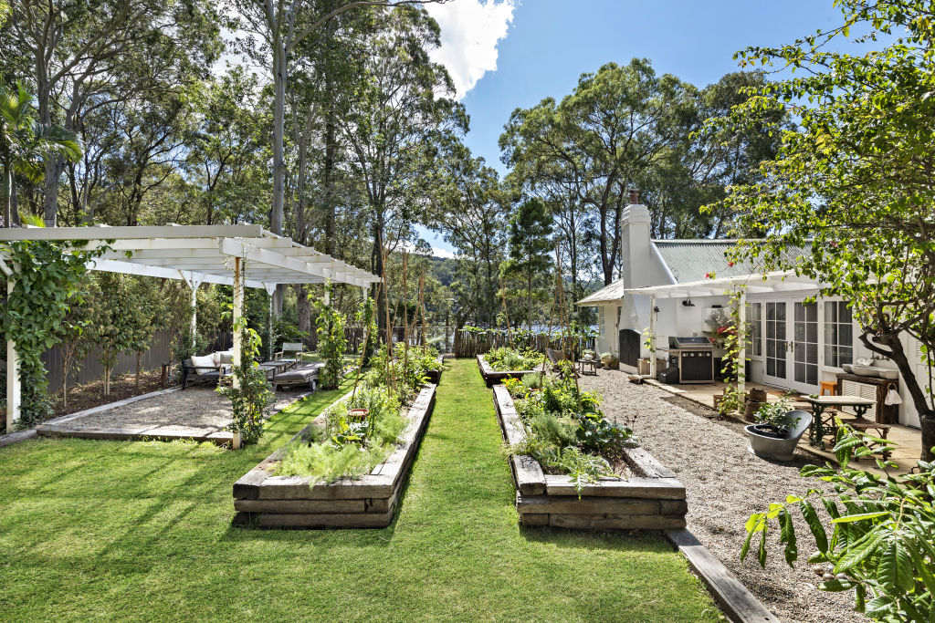 The garden has been perfectly landscaped to include a pergola seating area and an array of fruits, vegetables and flora. Photo: Supplied
