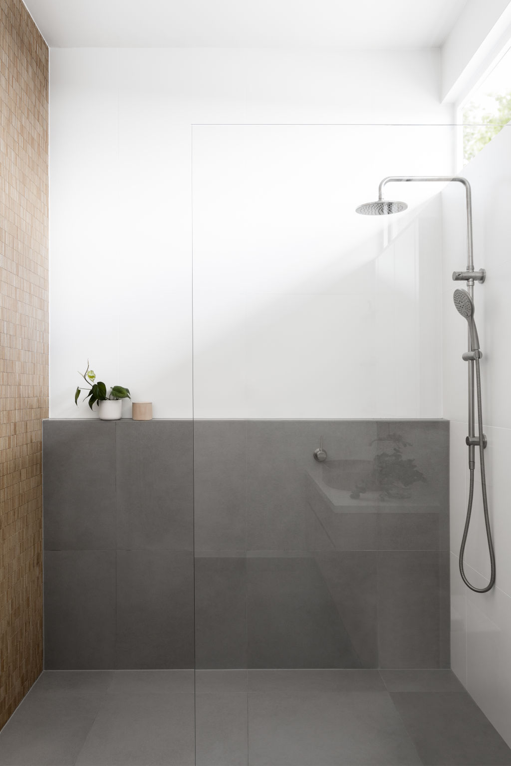 Perfectly practical ledges that run the length of the shower. Fairfield house by Heartly interior design studio. Photo: Martina Gemmola