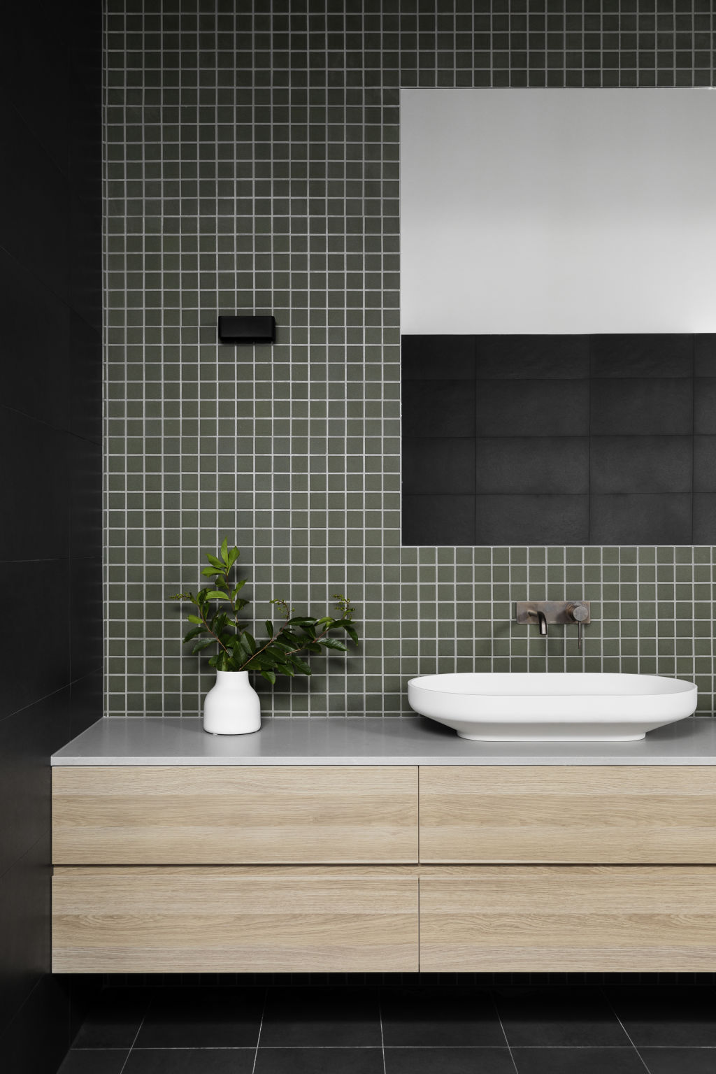 Deep green will continue to trend in feature tiles. Urban Barn house by Heartly interior design studio. Photo: Martina Gemmola