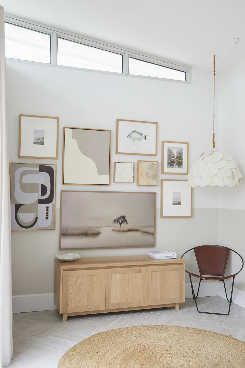 Statement furniture pieces and an array of collectibles give spaces colour and personality. Wall art includes the Samsung  Frame TV. Photo: Nicky Ryan